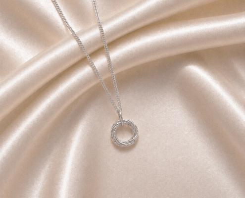 Love Knot Small _V2 Love Knot interlocking circle pendant, interlocking-circle necklaces and earrings celebrating love, unity, family and connection. Symbolic silver jewellery.